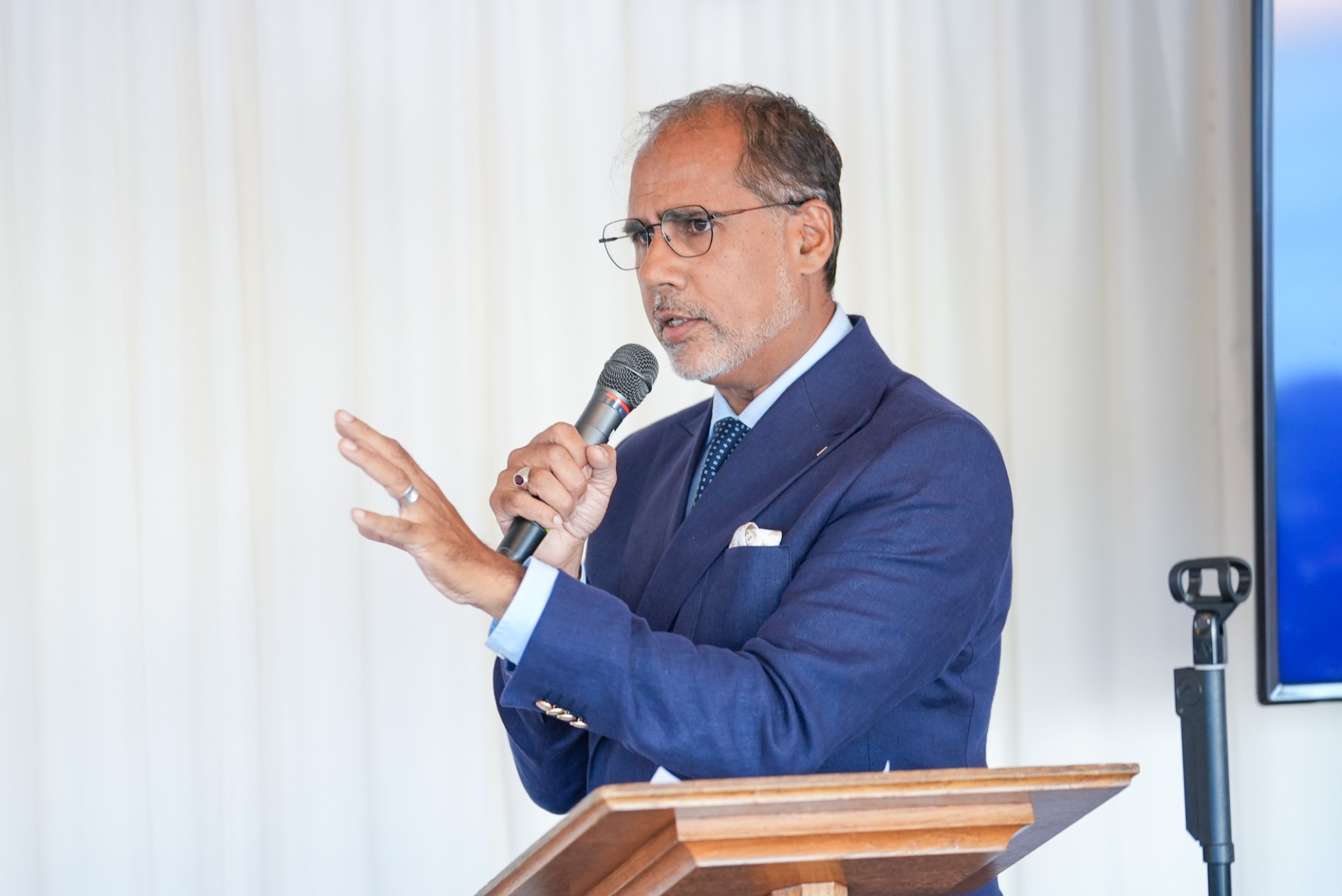 Alpesh Patel speaking at a lectern
